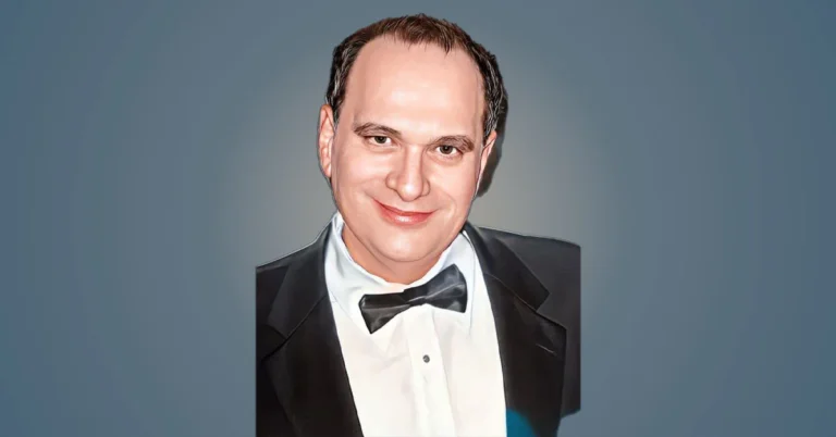 Bob Weinstein in a suit and bow tie