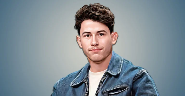 Nick Jonas with curly hair wearing a denim jacket