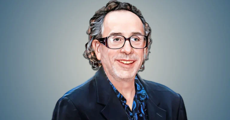 Tim Burton wearing glasses and a suit